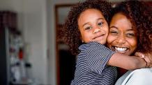 Young girl hugging her mom